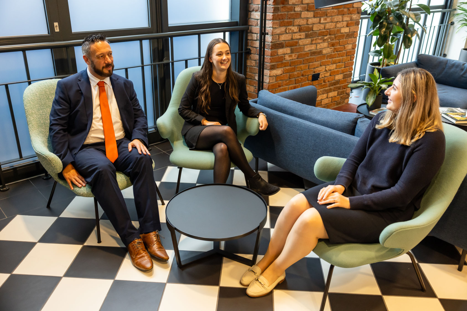 A couple speaking to a lawyer