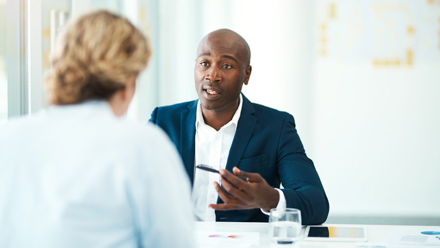 Man and woman looking at each other in conversation