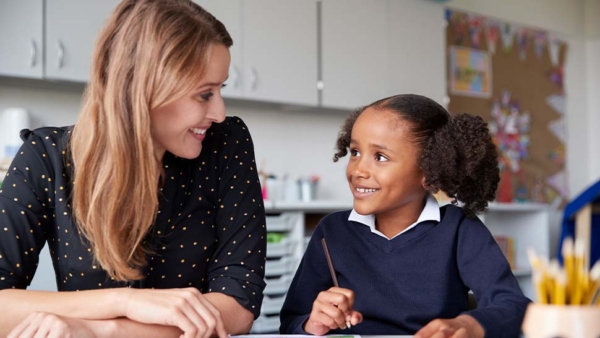 Lady and child looking at each other and smiling