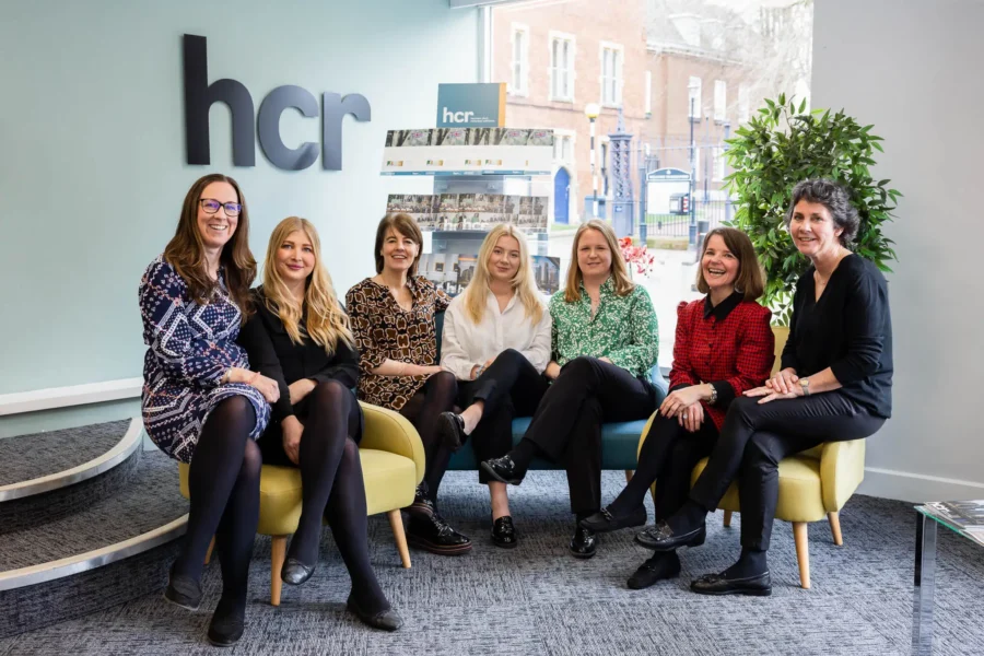 A group of people sitting in an office