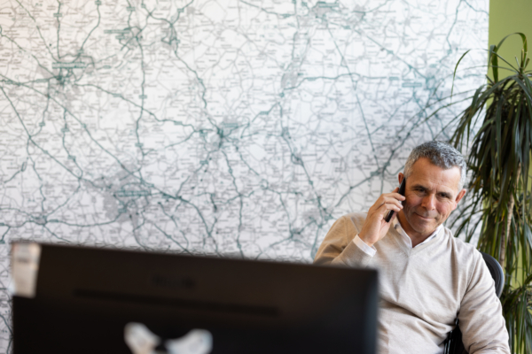 Partner talking on the phone in our office