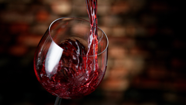 Red wine being poured into a glass