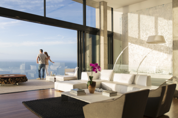 Couple standing on balcony of modern house